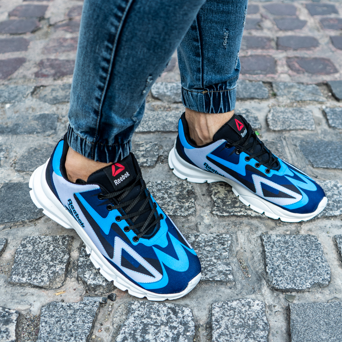 کفش ورزشی ریبوک آبی طوسی مردانه مدل Ervan