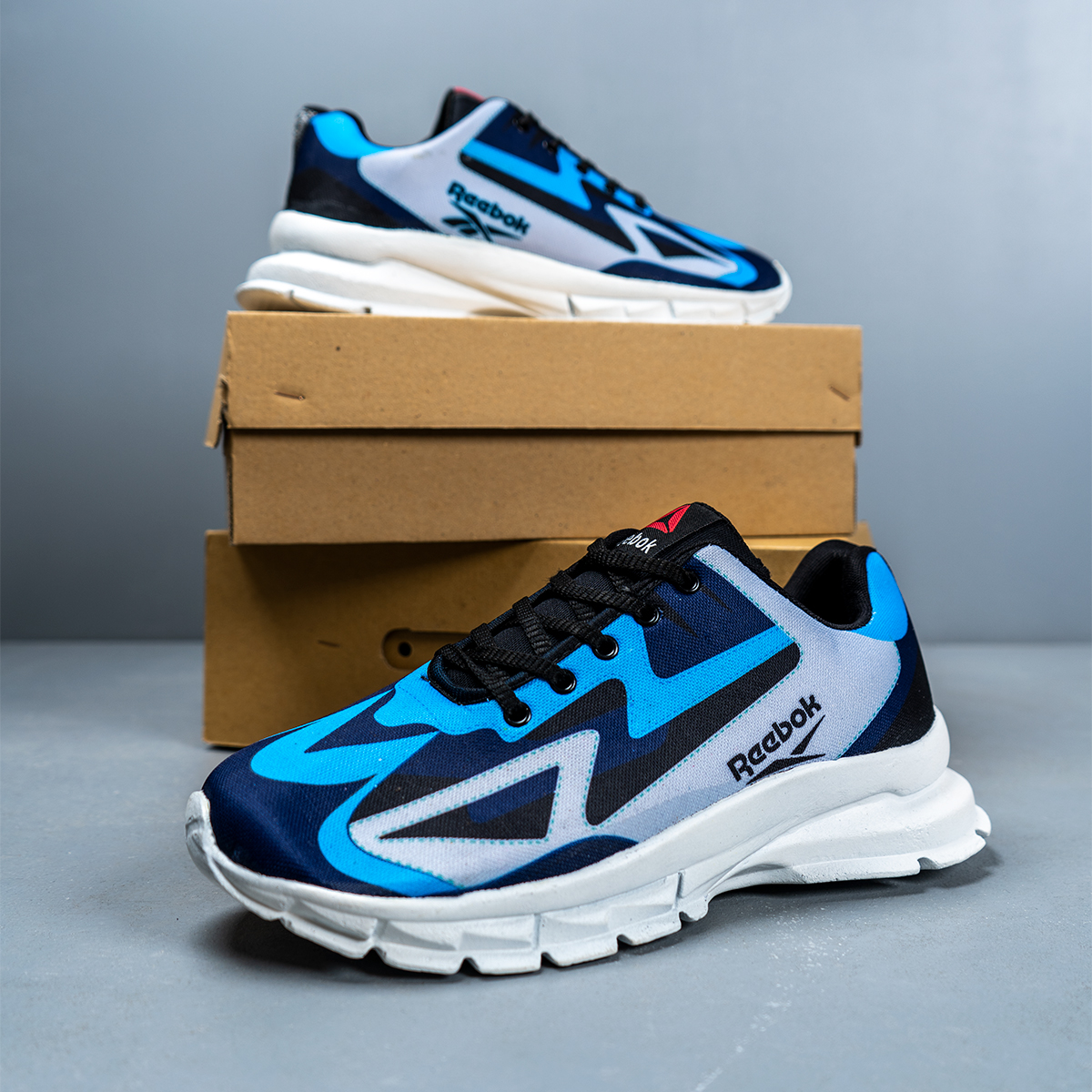 کفش ورزشی ریبوک آبی طوسی مردانه مدل Ervan